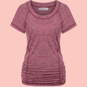 Women's red/burgundy sportswear top with open back detail